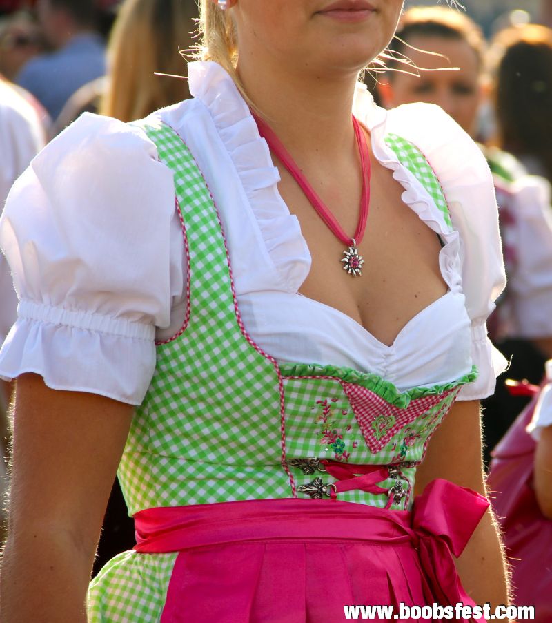 pink and green dirndl with a small edelweiß necklace