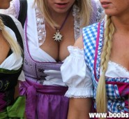 three blonde Oktoberfest angles in traditional skirts