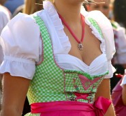 pink and green dirndl with a small edelweiß necklace